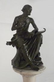DROUOT, E. La Leccin, escultura fda. E. Drouot, pedestal de mrmol jaspeado, con desgastes.