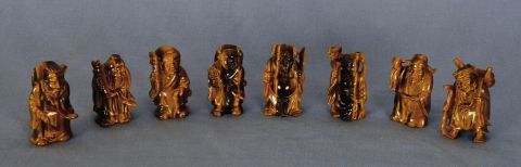 Figuras de ojo de tigre deidades. 8 Piezas.