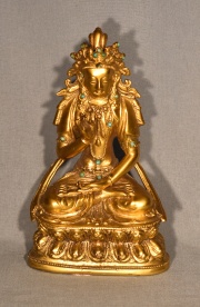 Figura tibetana con aplicaciones de turquesa s/flor de loto.