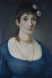 V. Usdin, Mujer con rosas, leo sobre tela. Mide: 59 x 49 cm.