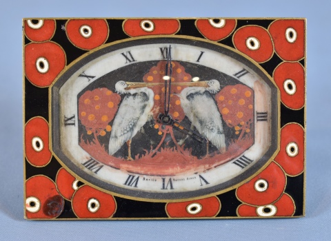 Reloj de mesa en bronce esmalte, con cachadura. Dos Aves zancudas. Frente 10,5 cm. Francia.