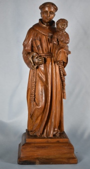 SAN ANTONIO Y EL NIO. Talla en madera del santo con el nio sobre el libro. Principios del XIX.