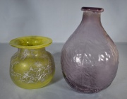 DOS VASOS DE VIDRIO ARTISTICO, uno de color violáceo y otro amarillo. Alto: 29 y 17 cm.