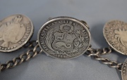 Rastra con monedas Peruana y boliviana. 139 gr.